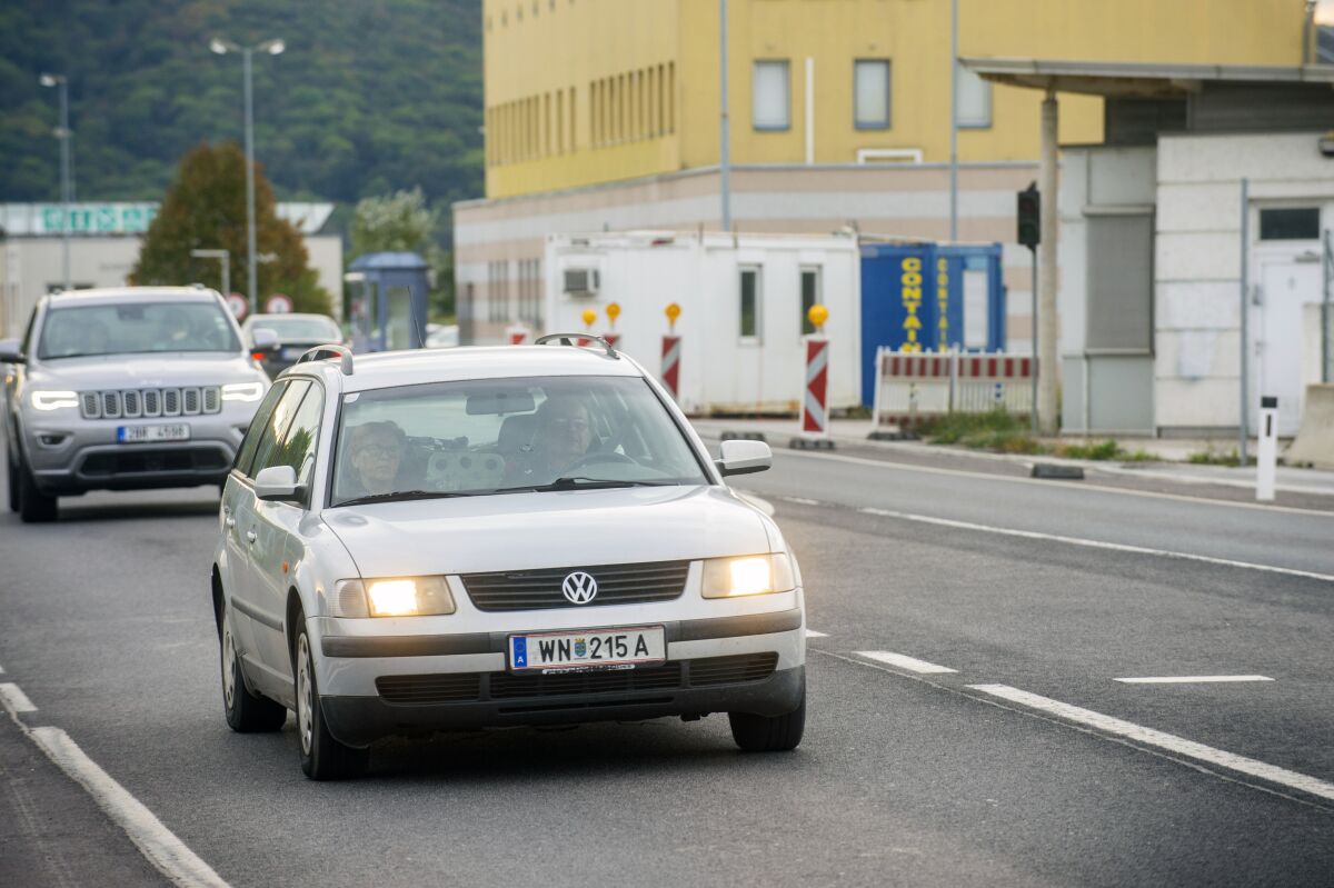 Cars make their way to the Austrian and Slovak border in Bratislava, Slovakia, Wednesday, Sept. 28, 2022. (Jakub Kotian/TASR via AP)