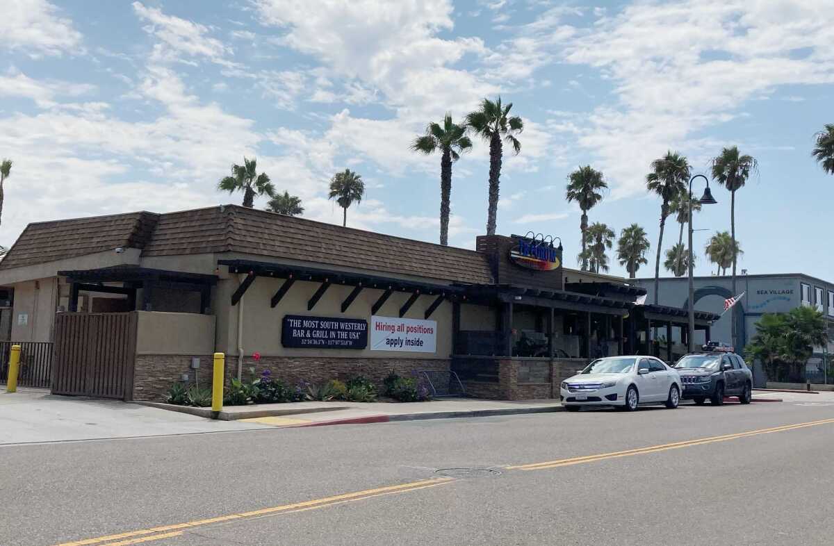 A sign advertising open jobs at the IB Forum Sports Bar & Grill in Imperial Beach.