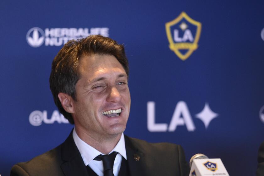 Los Angeles Galaxy head coach Guillermo Barros Schelotto speaks to the media during a press conference to introduce Javier "Chicharito" HernÃ(degrees)ndez in Carson, Calif., Thursday, Jan. 23, 2020. (AP Photo/Kelvin Kuo)