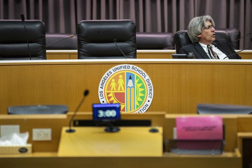 LOS ANGELES, CA - APRIL 20, 2018: Jefferson Crain, secretary to the Board of Education sits alone in the board room at LAUSD Headquarters after announcing there will be no decision made on a new school superintendent after being in Executive Session for more than 5 hours on April 20, 2018 in Los Angeles, California.(Gina Ferazzi/Los AngelesTimes)