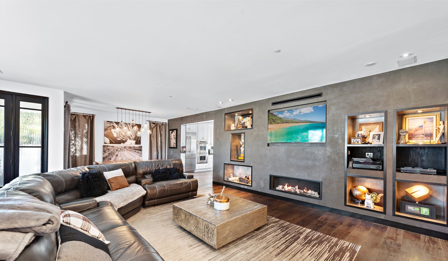 The 3,000-square-foot home includes a front deck facing the ocean and a private backyard with a dining cabana and hot tub.