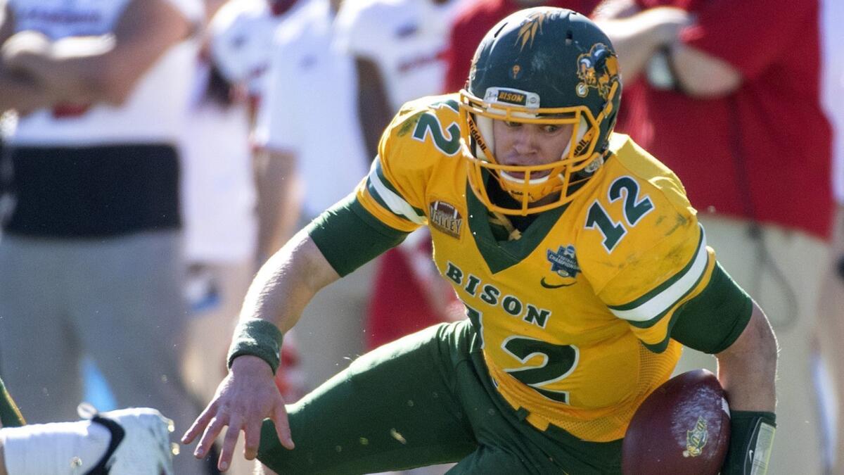 North Dakota State quarterback Easton Stick carries the ball during a game against Eastern Washington in January. Stick is hoping to make an impact for the Chargers at rookie minicamp.