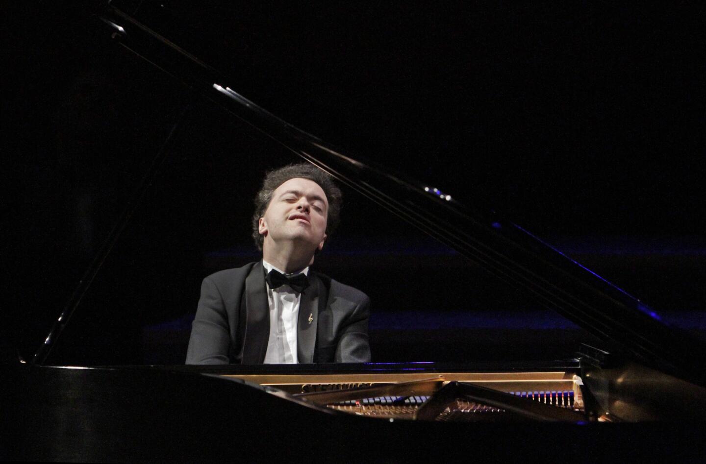 Evgeny Kissin, 42, played a program featuring Schubert and Scriabin at Walt Disney Concert Hall.
