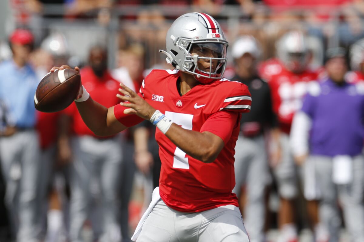 Ohio State quarterback C.J. Stroud drops back to pass against Oregon during the first half of an NCAA college football game Saturday, Sept. 11, 2021, in Columbus, Ohio. (AP Photo/Jay LaPrete)