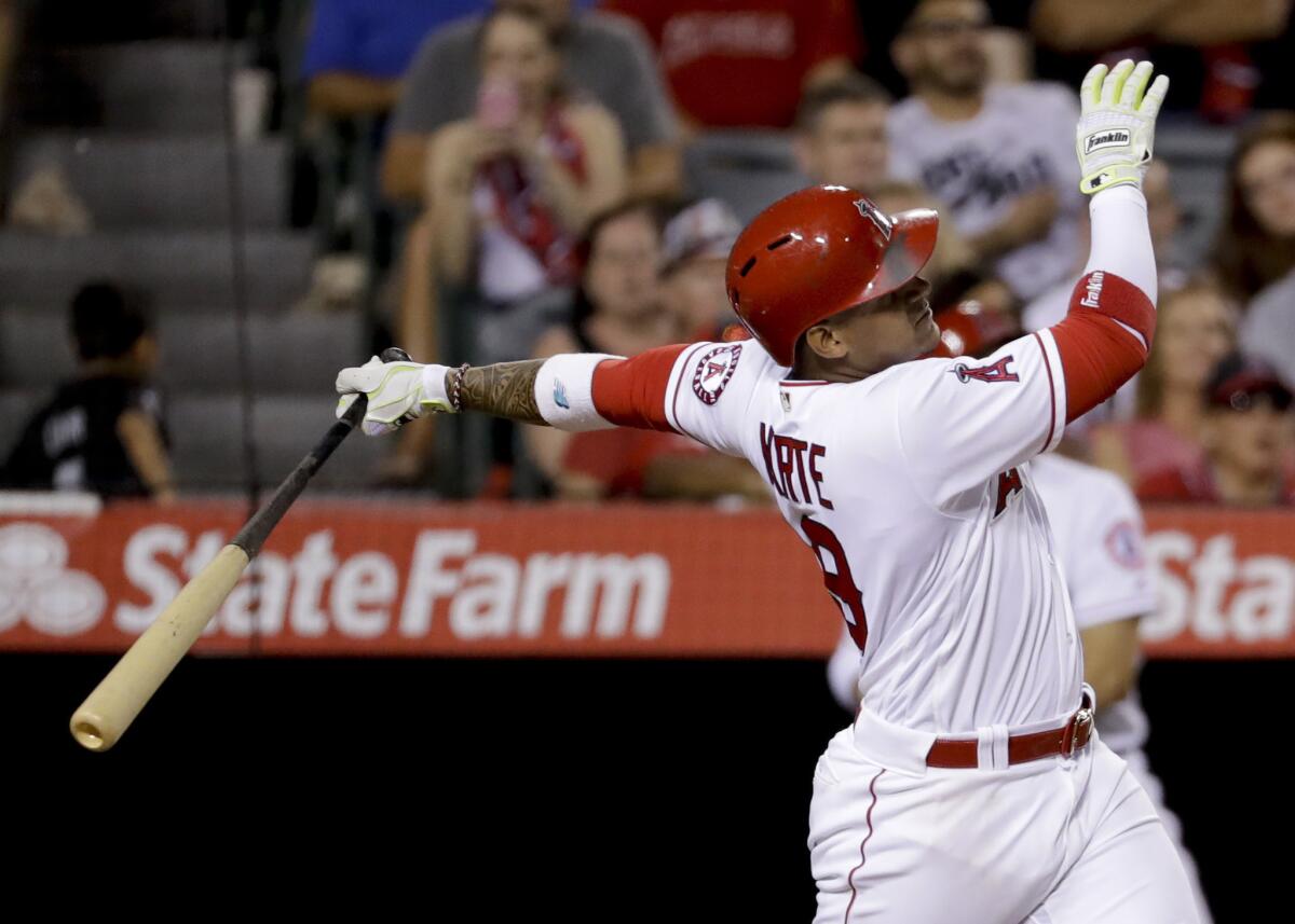 Angels infielder Jefry Marte watches his three-run home run during the sixth inning against the Athletics.