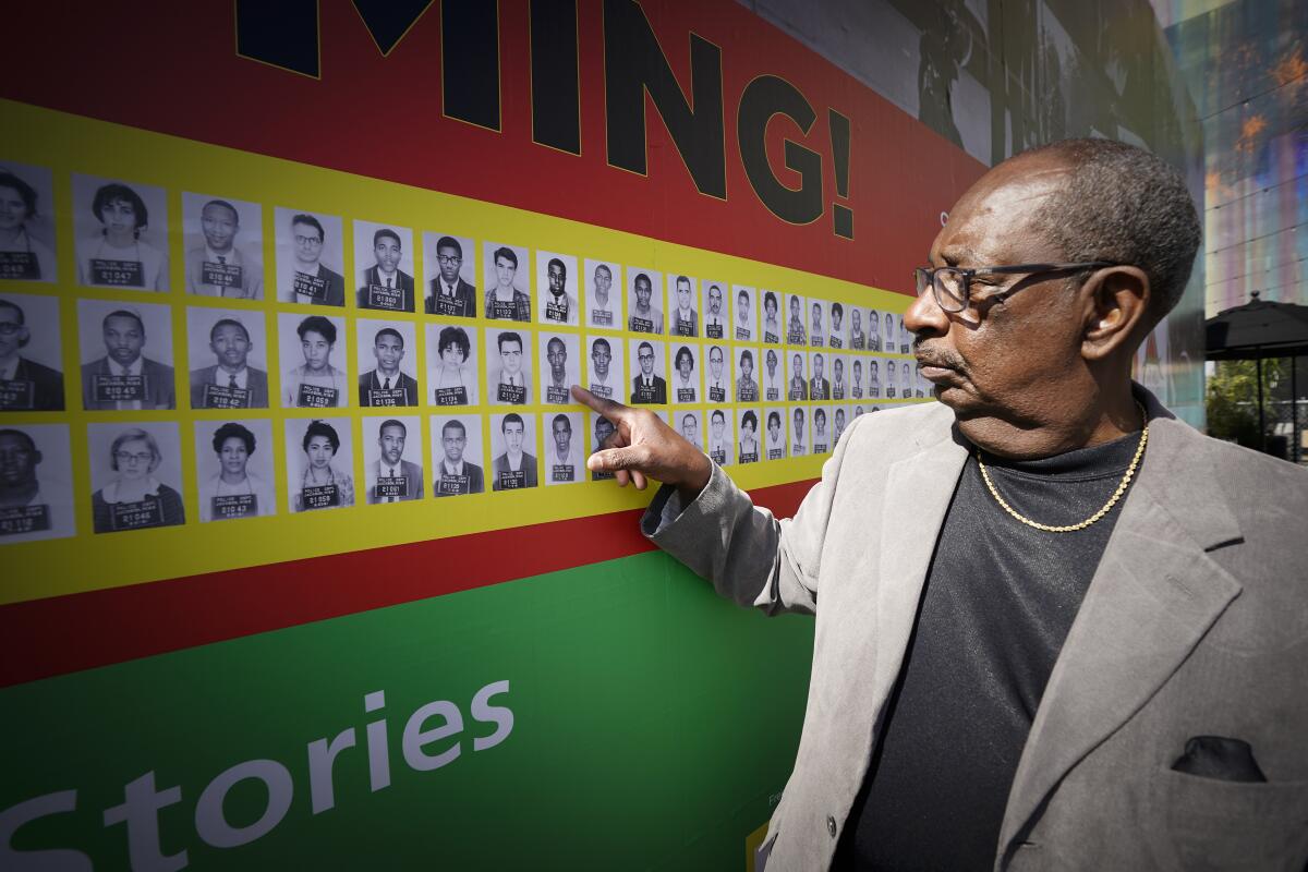 Freedom Rider Hezekiah Watkins, 73, pointed out his arrest booking photo, which is part of a new exhibit.