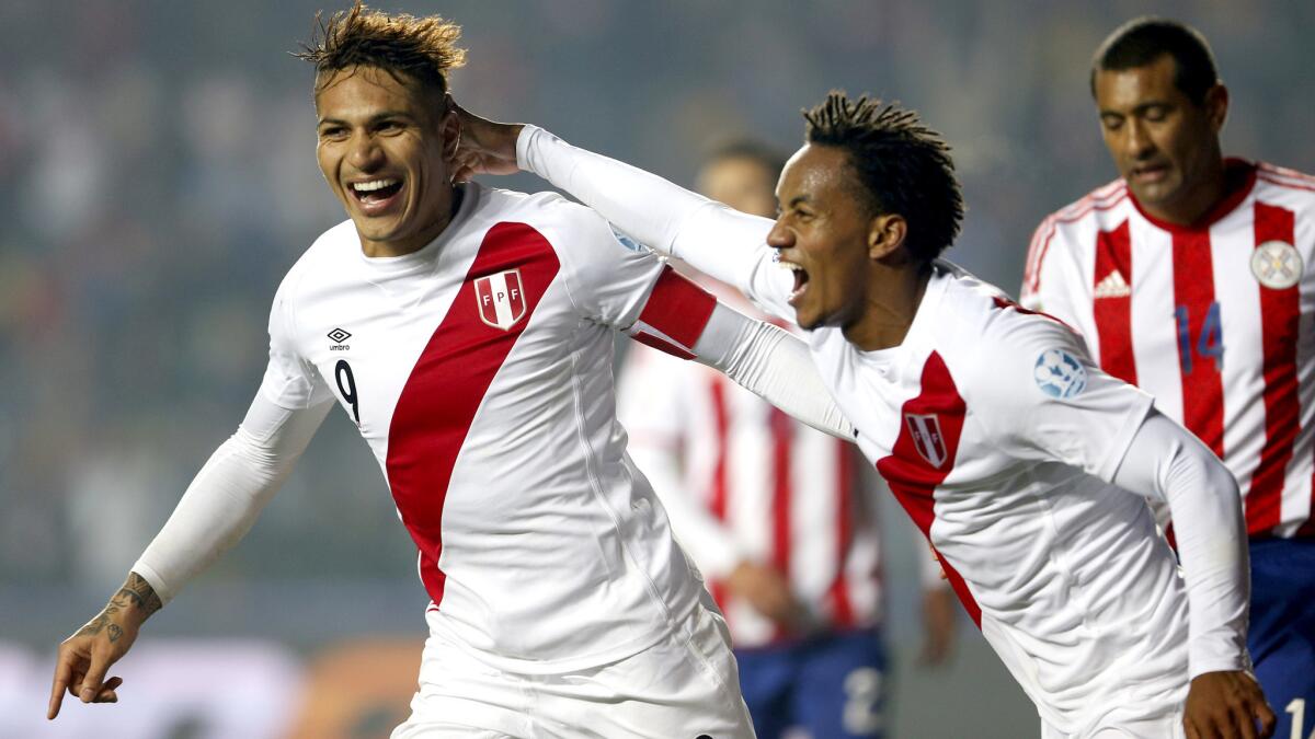 Jose Paolo Guerrero, left, celebrates with teammate Andre Carrillo after scoring Peru's second goal against Paraguay in the Copa America third-place game Friday. Carrillo scored the opening goal.