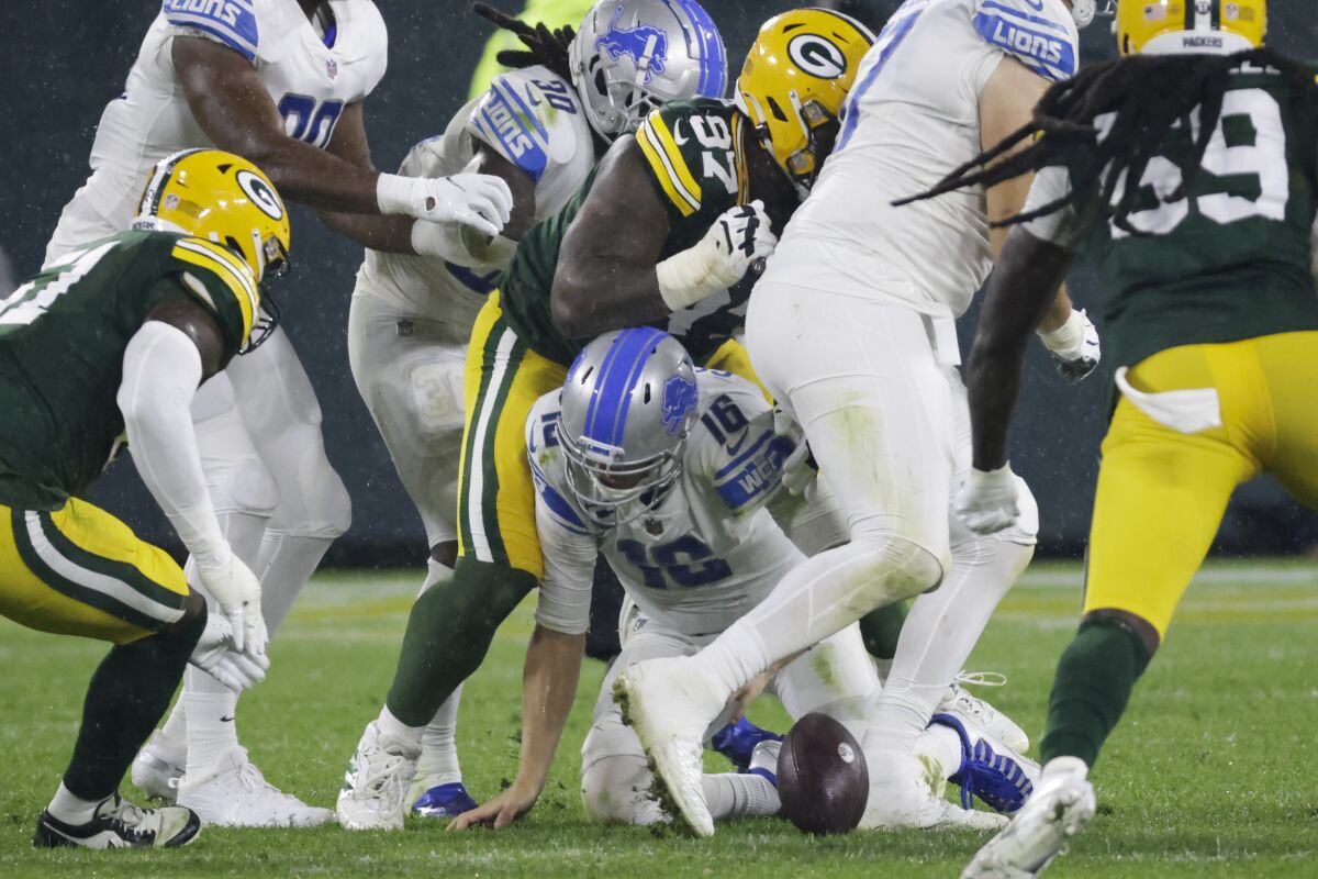 Detroit Lions' Jared Goff fumbles during the second half against the Green Bay Packers.