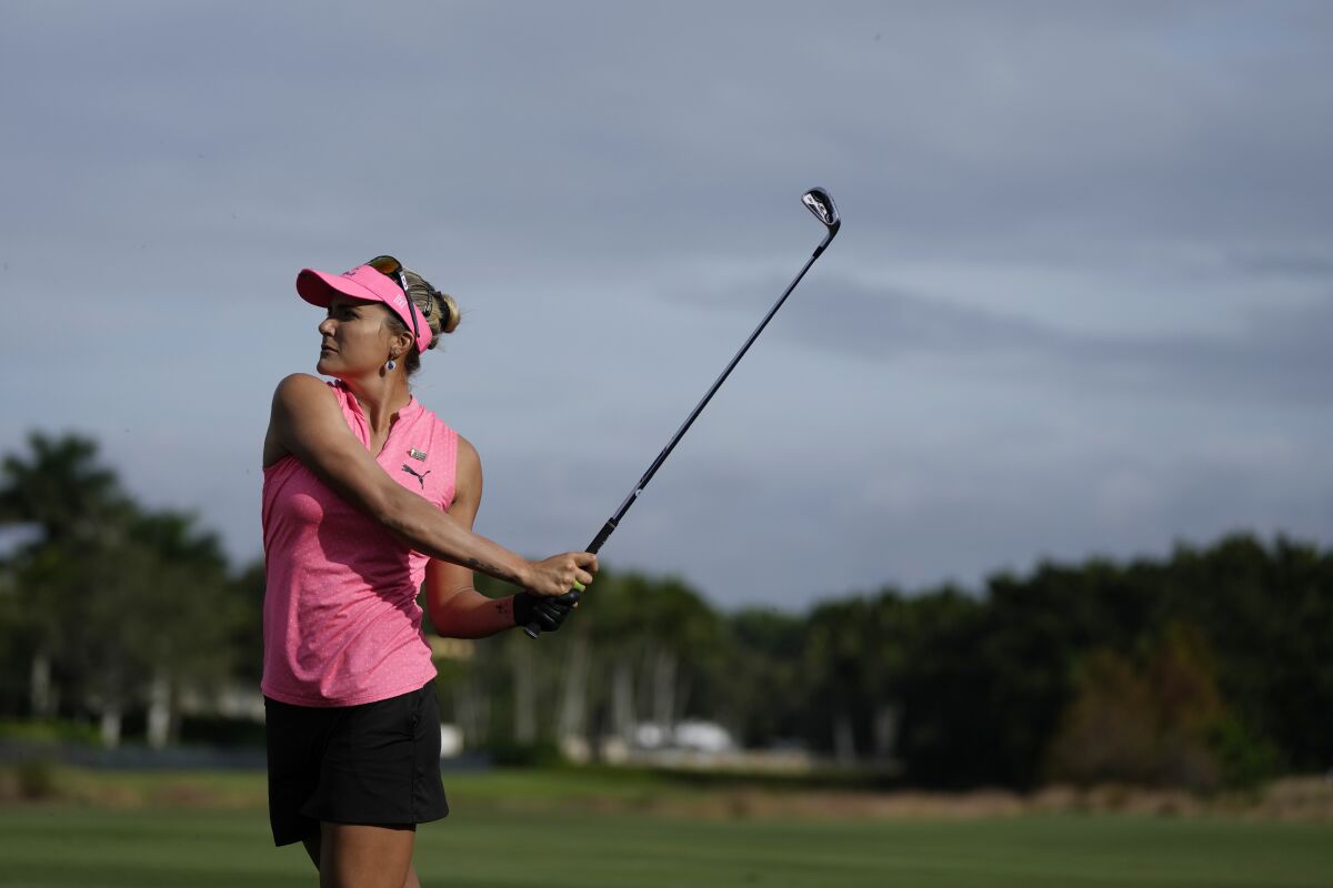 Lexi Thompson watches a shot from the 14th fairway during the third round of the LPGA Tour Championship golf tournament Saturday, Nov. 20, 2021, in Naples, Fla. (AP Photo/Rebecca Blackwell)