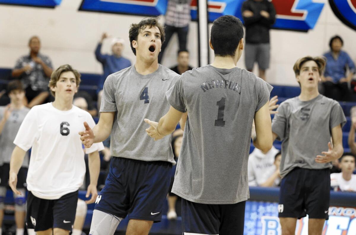 Newport Harbor High players disagree with a referee's call call against Beckman.
