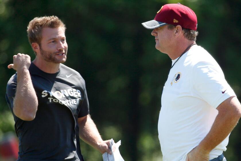 Washington Redskins offensive coordinator Sean McVay, left, talks with head coach Jay Gruden during practice at the team's NFL football training facility at Redskins Park, Wednesday, June 8, 2016 in Ashburn, Va. (AP Photo/Alex Brandon)