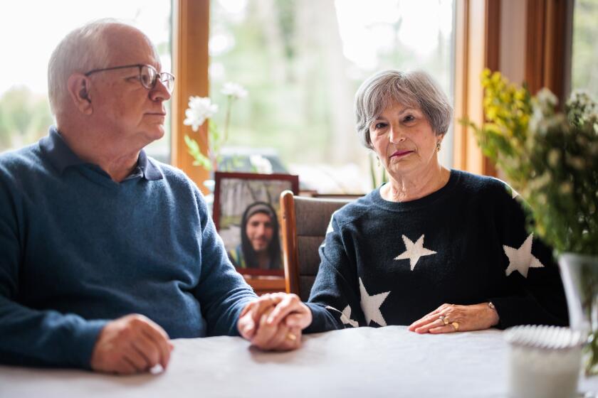 04/18/2023 Warwick, RI Celia (right) and Terry Harms (cq) at their home in Warwick, RI. Their son Jonathan Harms died in 2017 after receiving fentanyl-tainted pills. (Aram Boghosian/For The Times)