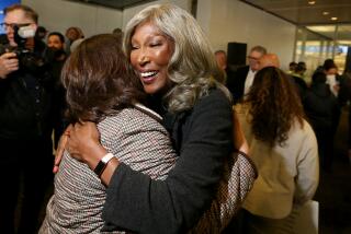 Los Angeles, CA - Cynthia McClain-Hill, center, hugs a co-worker after stepping down as president of the Los Angeles Department of Water and Power during a board meeting on Tuesday, Jan. 9, 2023. (photographer} / Los Angeles Times)