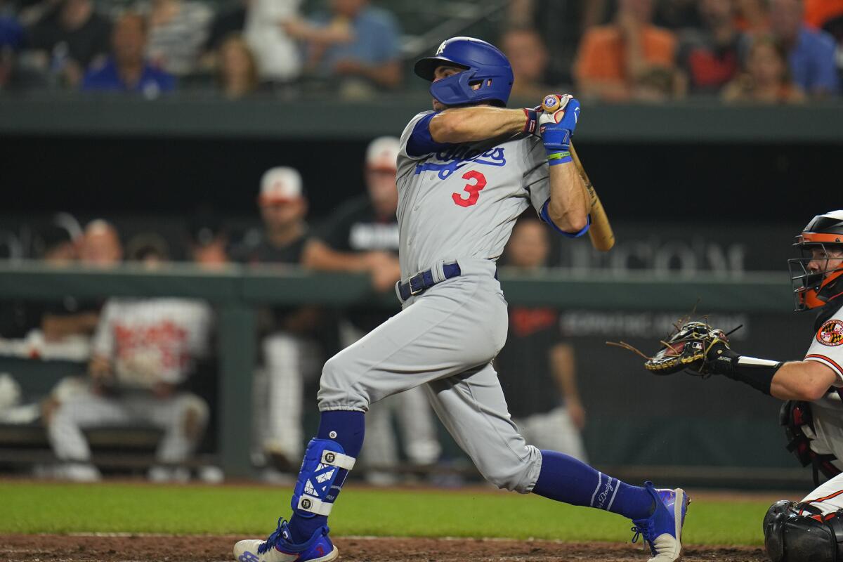 Dodgers' Chris Taylor follows through on a swing against the Baltimore Orioles.