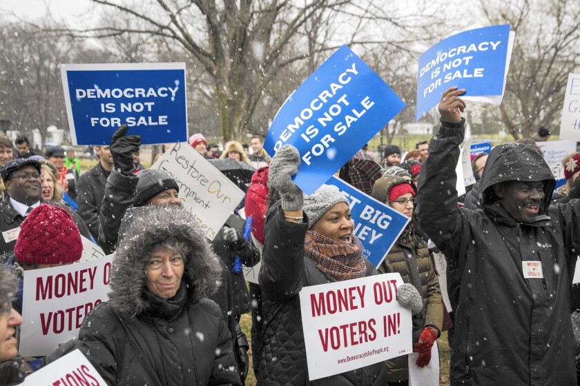 A protest calling for an end to corporate money in politics and to mark the fifth anniversary of the Supreme Court's Citizens United decision is held in Lafayette Square near the White House.
