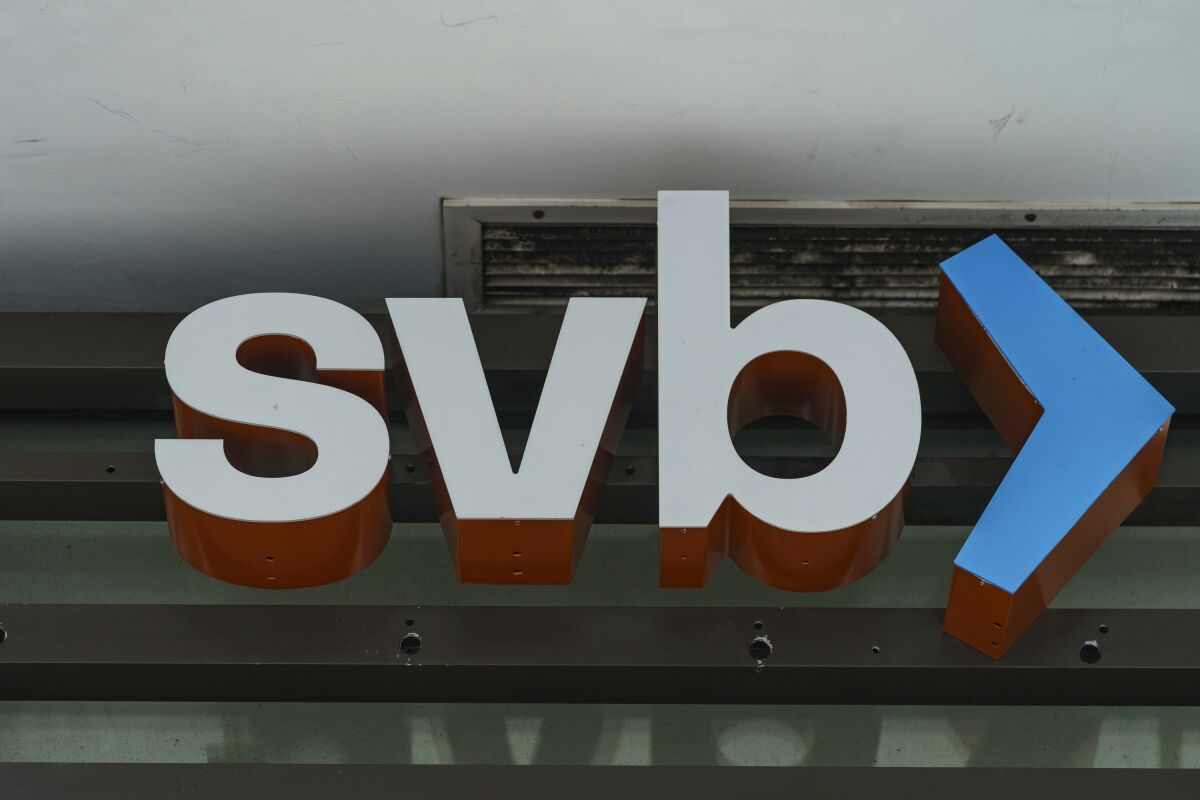 FILE - The Silicon Valley Bank logo is seen at an open branch in Pasadena, Calif., on March 13, 2023. A handful of red state Democrats were instrumental helping Republicans secure a rollback of banking regulations sought by then-President Donald Trump in 2018. Now those changes are being blamed for contributing to the recent collapse of Silicon Valley Bank and Signature Bank that prompted a federal rescue and stoked anxiety about a broader banking contagion. (AP Photo/Damian Dovarganes, File)