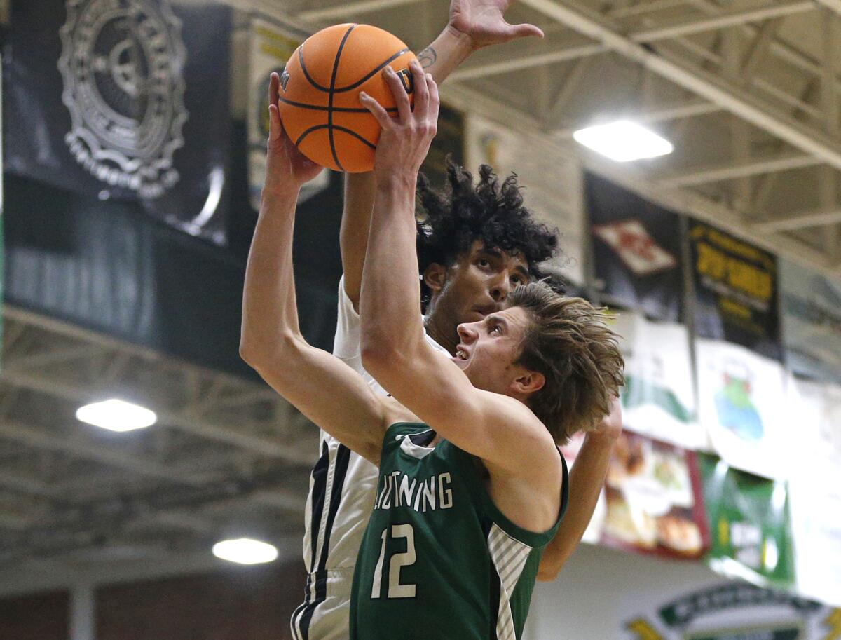 Sage Hill's Gage Talleur (12) drives to the basket and is fouled in the process during Saturday's game.