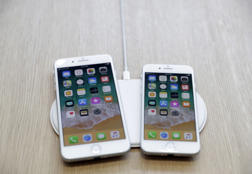 Apple iPhones using an AirPower wireless charger. 