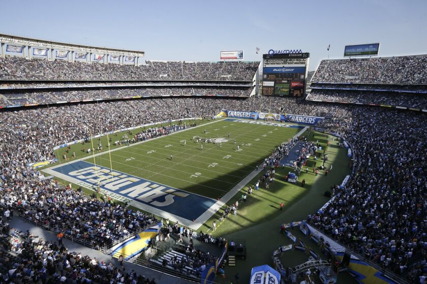 The San Diego Chargers play against the Oakland Raiders at Qualcomm Stadium in November. San Diego Mayor Kevin Faulconer announced Monday that the city is prepared to hold a Dec. 15 special election to seek voter approval to build a stadium to replace the aging stadium.