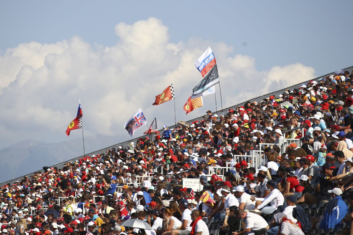 Spectators are on the stands during the Russian Formula One Grand Prix, at the Sochi Autodrom circuit, in Sochi, Russia, Sunday, Sept. 27, 2020. (Bryn Lennon, Pool via AP)