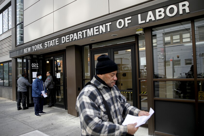 Visitors are turned away from the Department of Labor in New York, which was closed in March under coronavirus restrictions.
