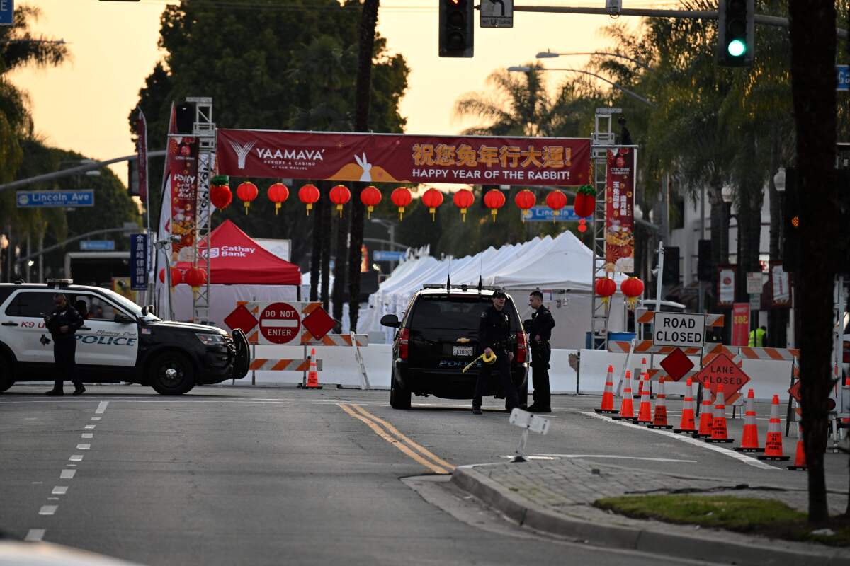Police work near tents set up for Lunar New Year events.