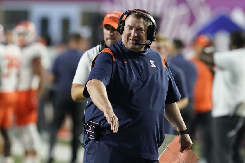 Illinois head coach Bret Bielema smiles after a touchdown during the first half of an NCAA college football game against Indiana, Friday, Sept. 2, 2022, in Bloomington, Ind. (AP Photo/Darron Cummings)