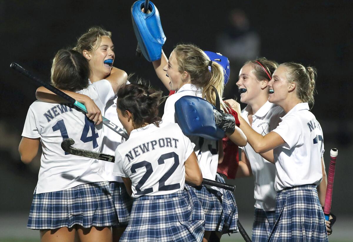 Newport Harbor celebrates the win over Marina during the semifinals of the Los Angeles Field Hockey Assn. TOC on Thursday.