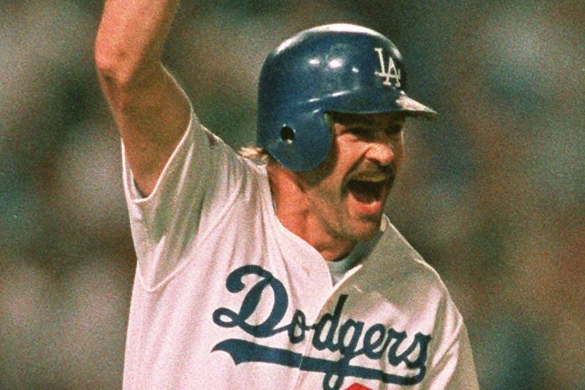 ADVANCE FOR WEEKEND EDITIONS, JUNE 7-8 -- FILE -- Los Angeles Dodgers' Kirk Gibson celebrates his game-winning two run homer against the Oakland Athletics as he rounds the bases at Dodger Stadium in Los Angeles during the first game of the World Series, in this Oct. 15, 1988 photo. (AP Photo/Rusty Kennedy)