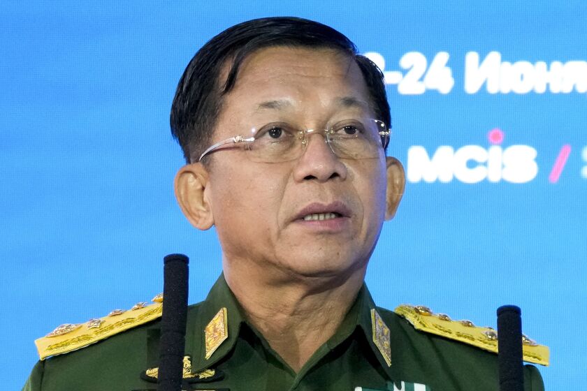 FILE - Commander-in-Chief of Myanmar's armed forces, Senior Gen. Min Aung Hlaing delivers his speech at the IX Moscow conference on international security in Moscow, Russia, June 23, 2021. Myanmar’s military-controlled government has enacted a new law on registration of political parties that will make it difficult for opposition groups to mount a serious challenge to army-backed candidates in a general election set to take place later this year. (AP Photo/Alexander Zemlianichenko, Pool, File)