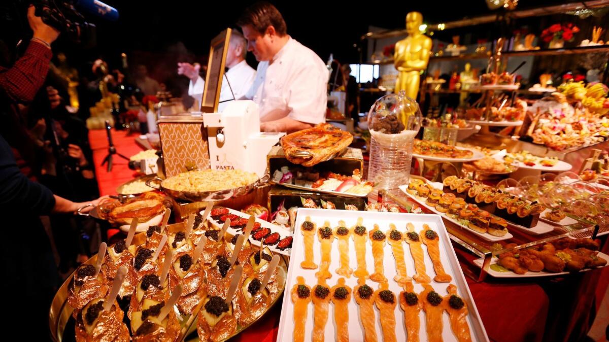 The table for chef Wolfgang Puck, is full of his creations for the 89th Oscars Governors Ball press preview.