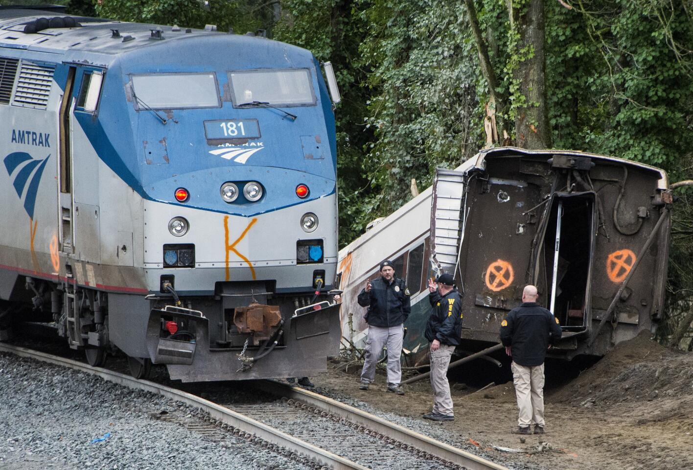 Emergency crews respond after an Amtrak train derailed on Dec. 18, 2017, in DuPont, Wash.