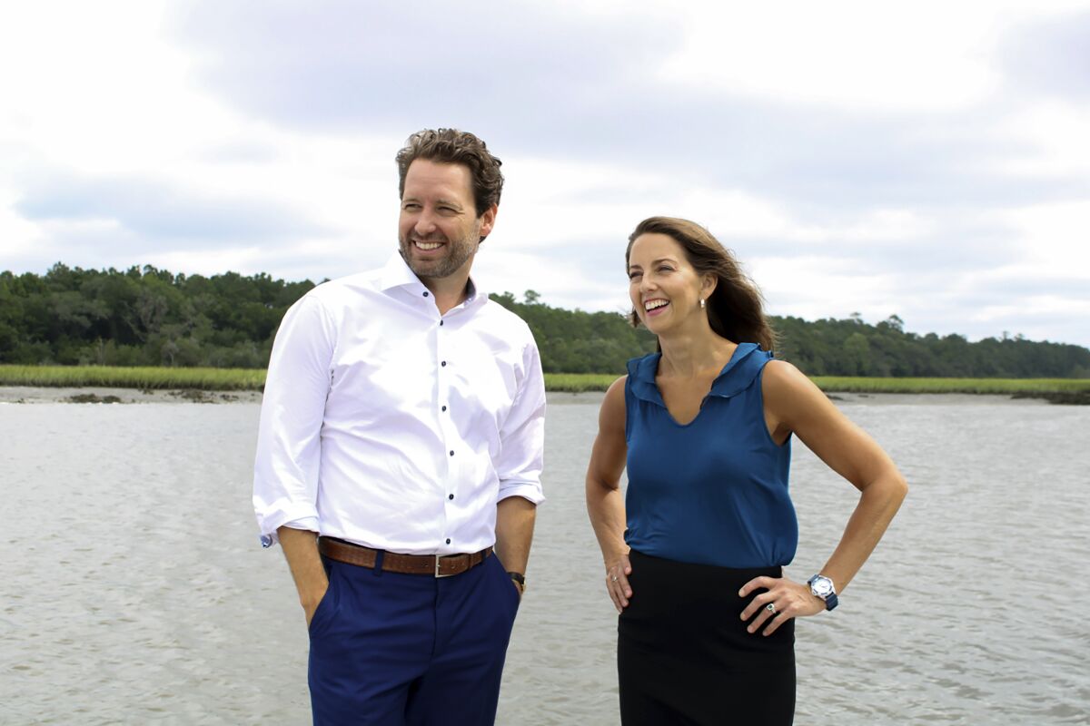 This photo provided by Tyler Jones shows Joe Cunningham, left, and Talley Parham Casey, right, a former fighter pilot-turned lawyer, his running mate in his quest to become South Carolina's first Democratic governor in 20- years. Cunningham, who previewed his pick last week for The Associated Press ahead of a formal rollout later Monday, Aug. 1, 2022 said that Casey's broad experience is the right match for the new generation of leadership he hopes to bring to South Carolina's top office. Cunningham planned to formally announce his pick later Monday. (Tyler Jones via AP)