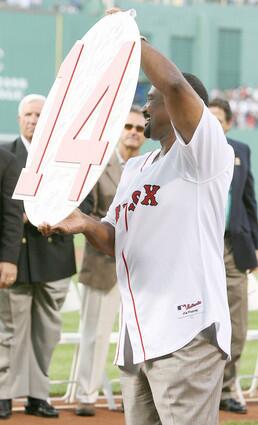 Former Boston Red Sox outfielder Jim Rice shows off his retired number plaque during a ceremony before the Boston Red Sox game against the Oakland Athletics at Fenway Park July 28, 2009 in Boston.