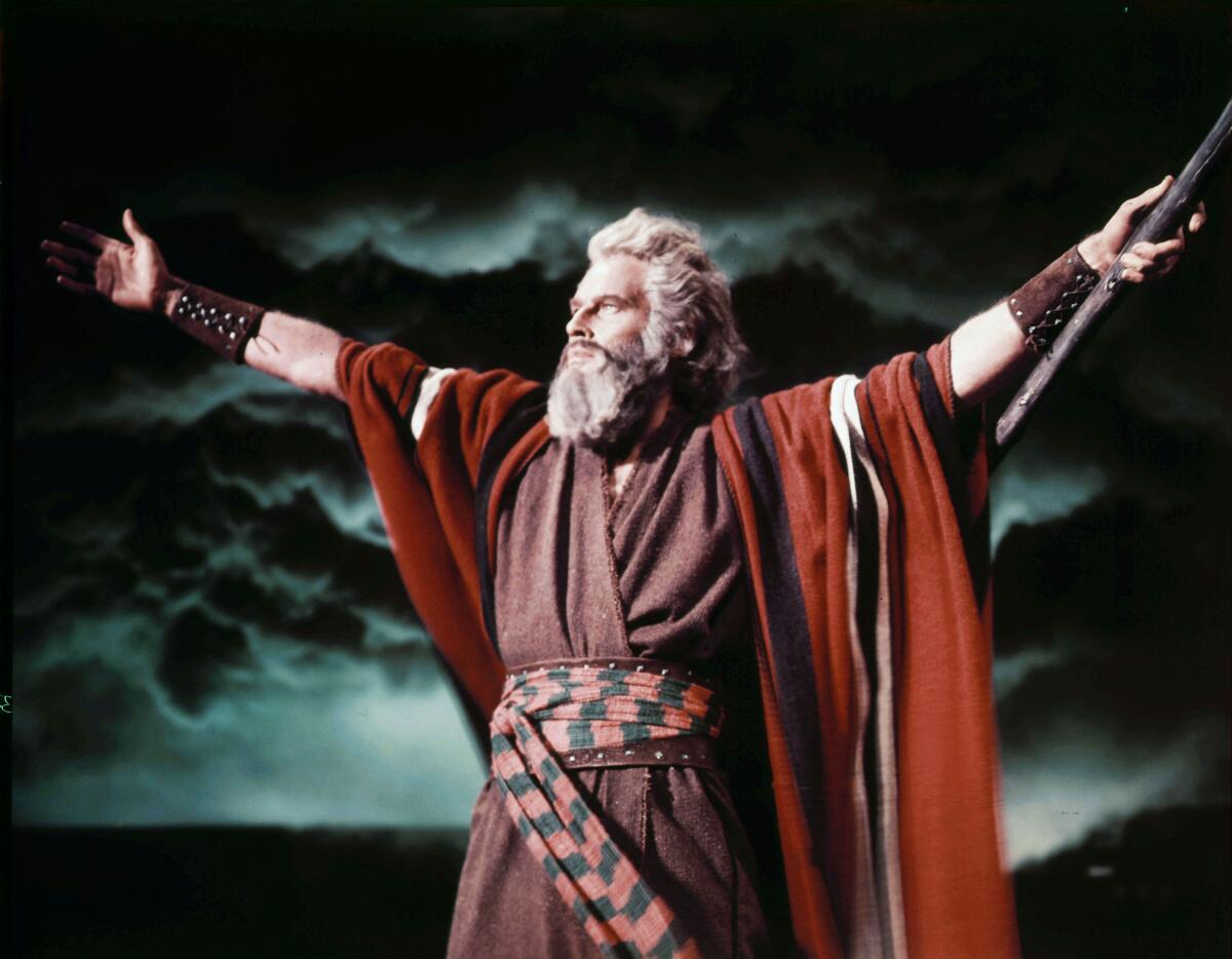 Charlton Heston as Moses raises his arms in "The Ten Commandments"
