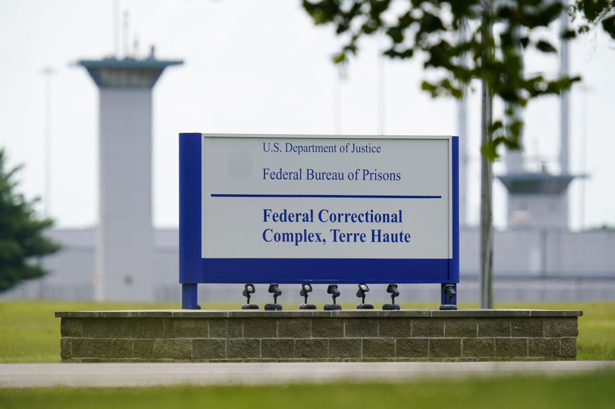 FILE - In this Aug. 28, 2020, file photo, the federal prison complex in Terre Haute, Ind. Two inmates have died in as many days from coronavirus at the federal prison complex where the U.S. government plans to carry out two federal executions next week. (AP Photo/Michael Conroy, File)