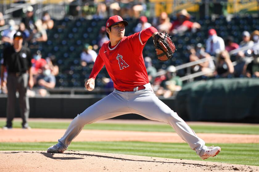 Angels pitcher Shohei Ohtani delivers during a spring training game against the Oakland Athletics on Friday, March 5, 2021.