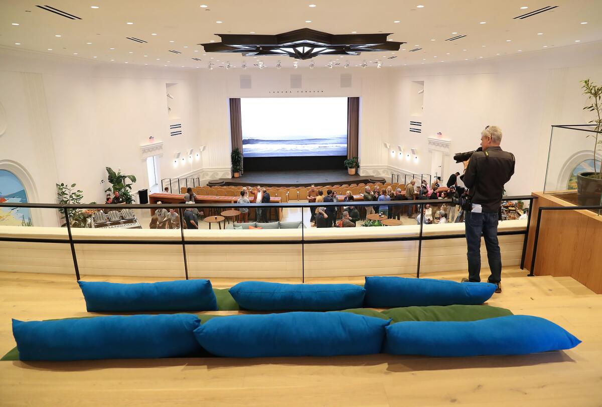 Guests enjoy a look at the renovated Rivian South Coast Theater during a dedication event on Friday in Laguna Beach.