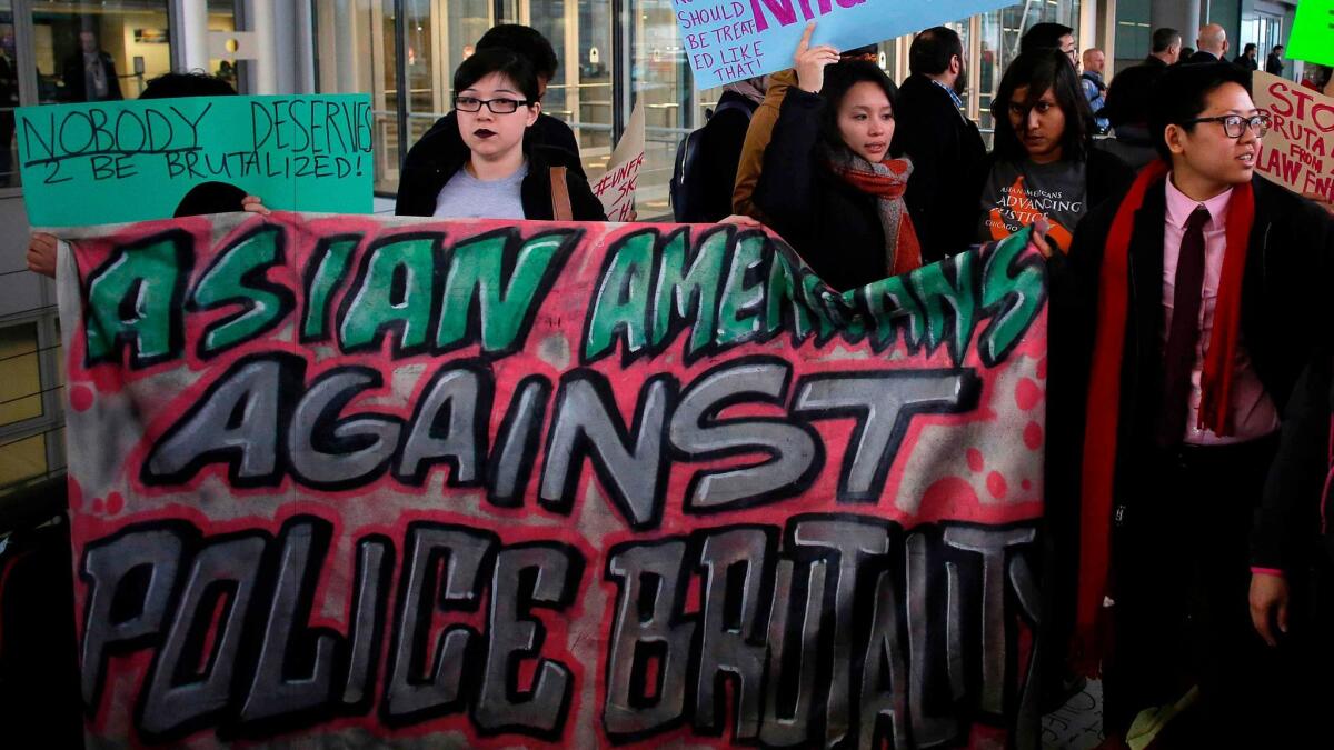 Demonstrators protest United Airlines on April 11 at O'Hare International Airport in Chicago.