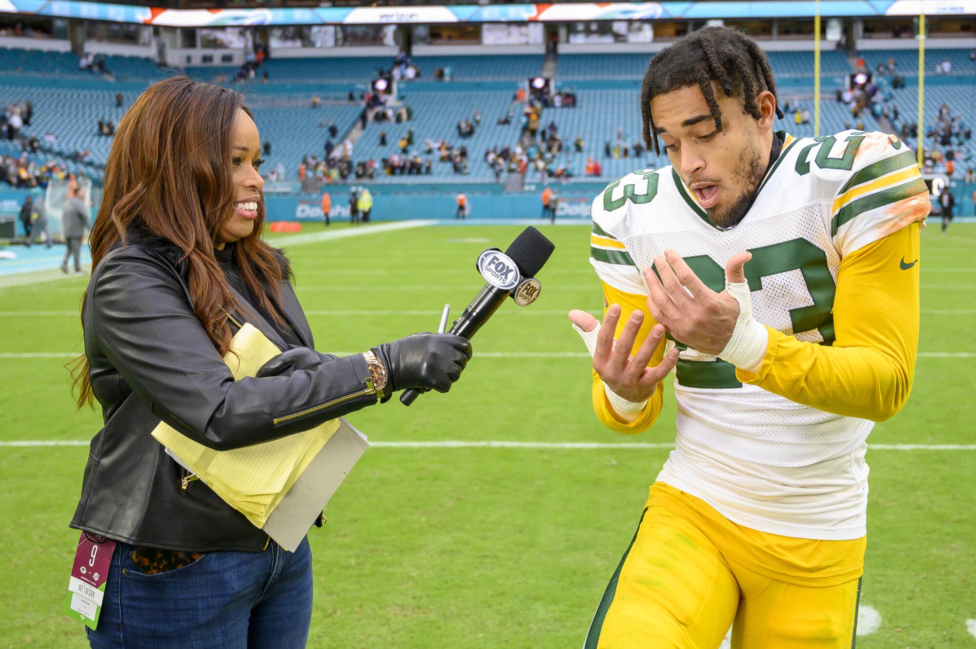 Fox Sports sideline reporter Pam Oliver interviews Packers cornerback Jaire Alexander (23) on the field on Dec. 25, 2022