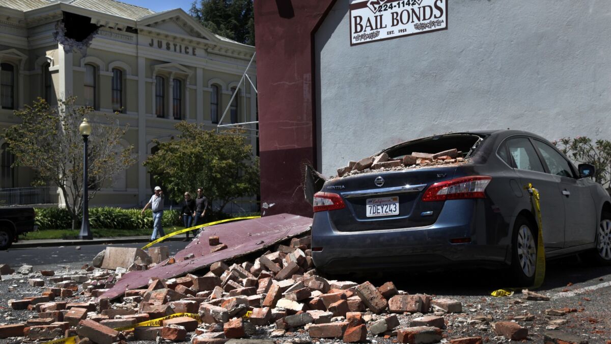 Bricks from a building owned by Brian Silver fell on to the parking lot and a parked car during the 2014 Napa earthquake.