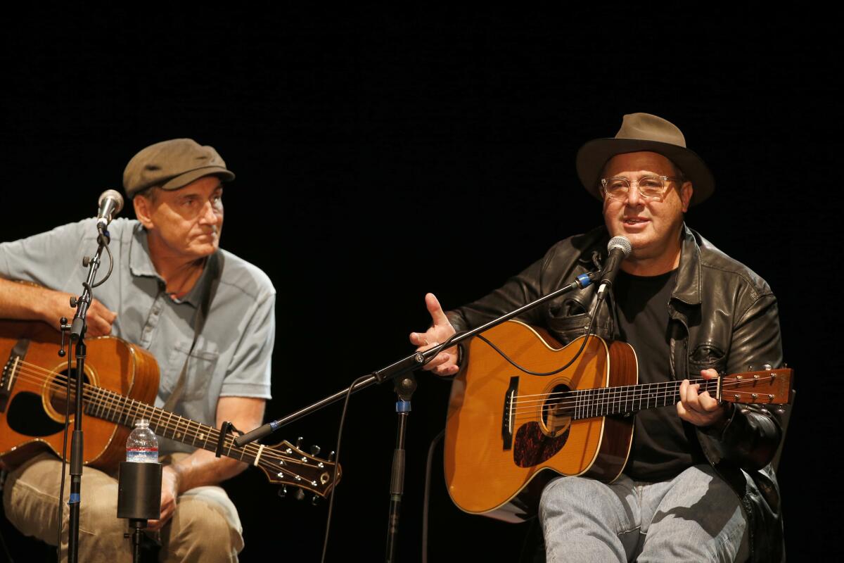 James Taylor, left, and Vince Gill perform at the All for the Hall Los Angeles at the Novo Theatre on Sept. 27, 2016.