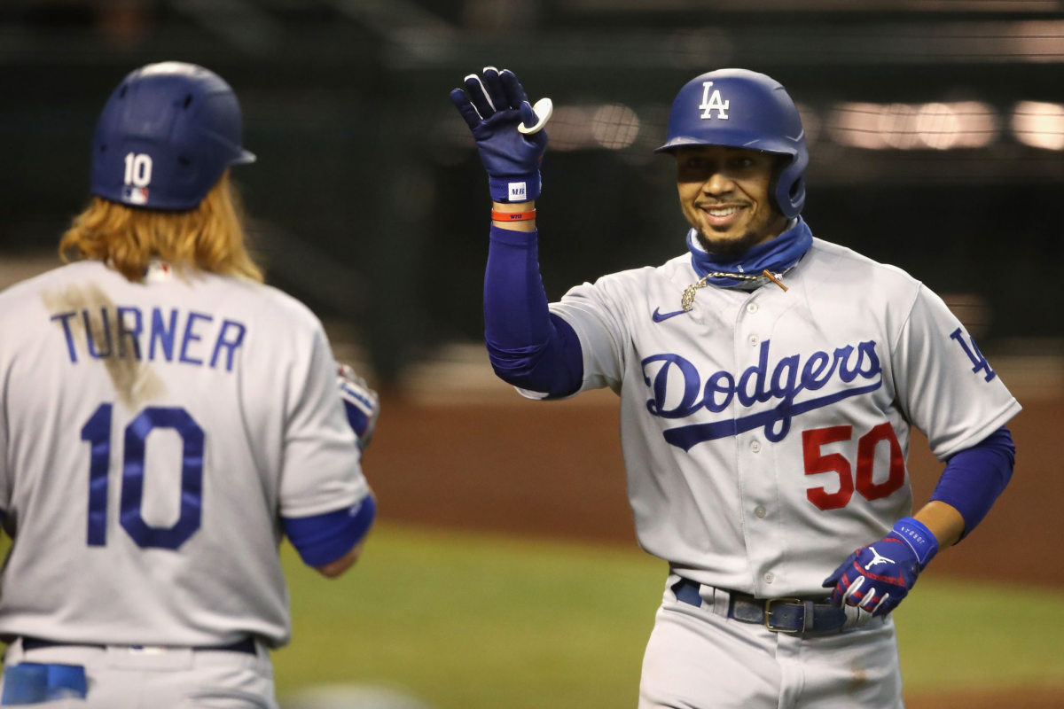 PHOENIX, ARIZONA - AUGUST 02: Mookie Betts #50 of the Los Angeles Dodgers celebrates with Justin Turner.