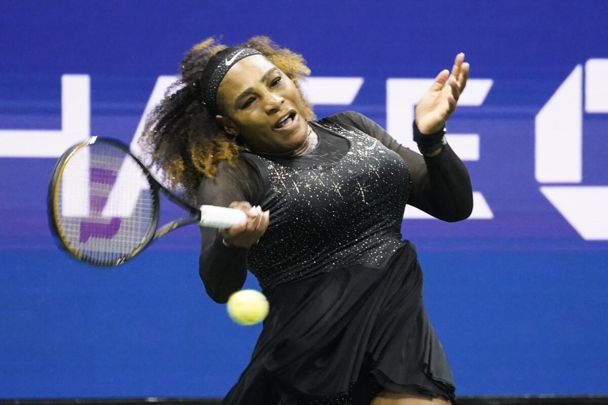 Serena Williams returns a shot during her first-round match against Danka Kovinic.