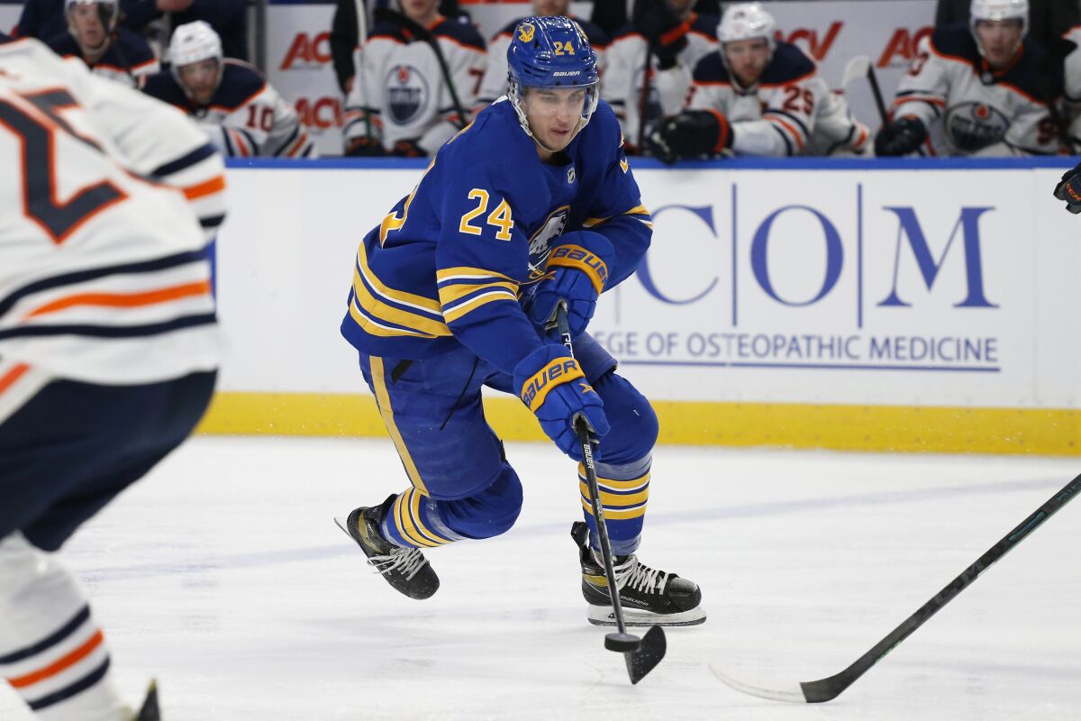 Buffalo Sabres center Dylan Cozens (24) carries the puck during the first period of the team's NHL hockey game against the Edmonton Oilers, Friday, Nov. 12, 2021, in Buffalo, N.Y. (AP Photo/Jeffrey T. Barnes)