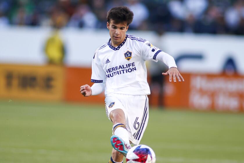 LA Galaxy midfielder Riqui Puig (6) passes the ball against the Seattle Sounders.