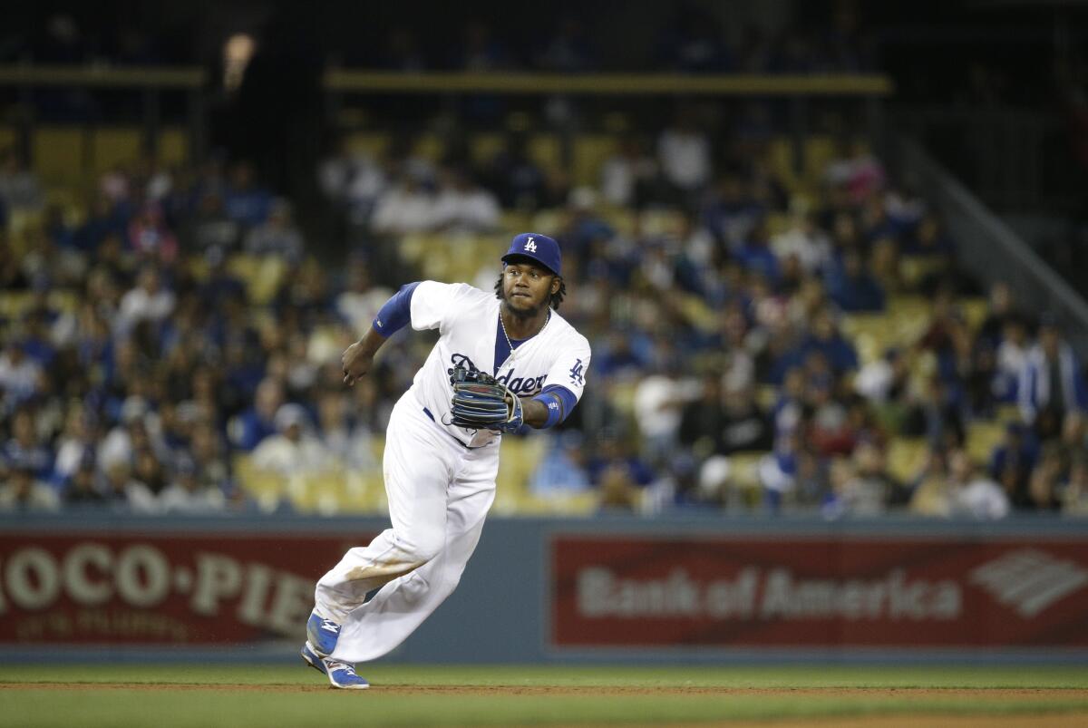 Dodgers shortstop Hanley Ramirez goes after the ball during the ninth inning against Philadelphia on Tuesday.