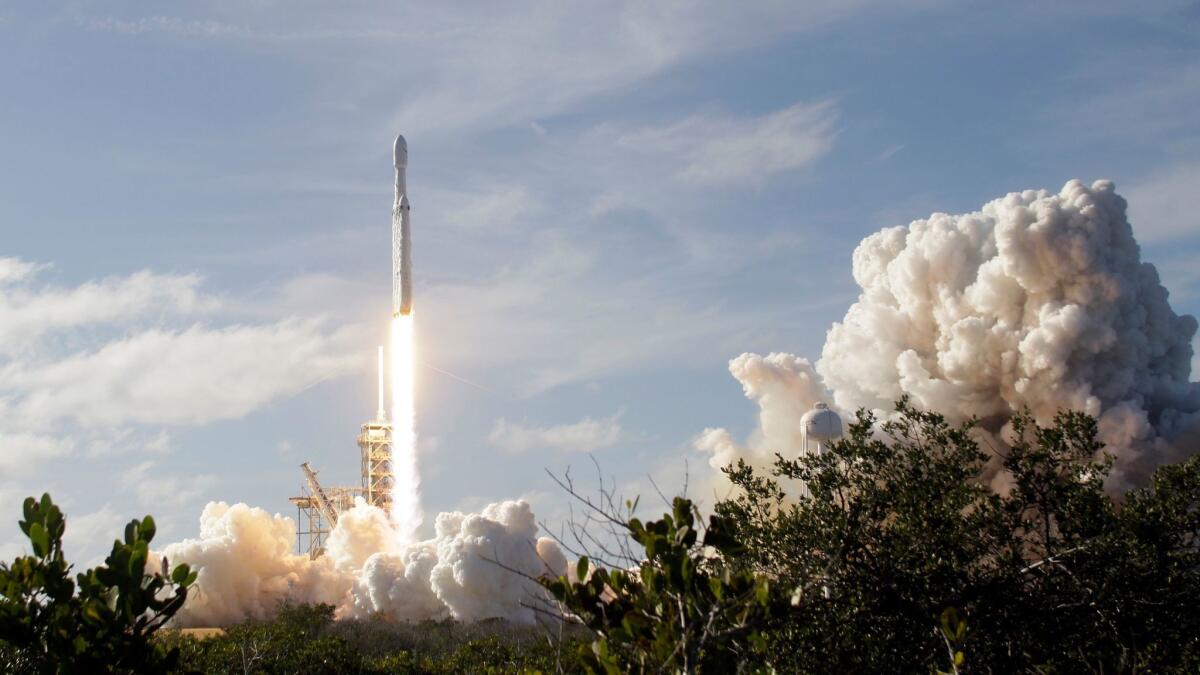 SpaceX's Falcon Heavy rocket lifts off from Cape Canaveral, Fla., on Tuesday.