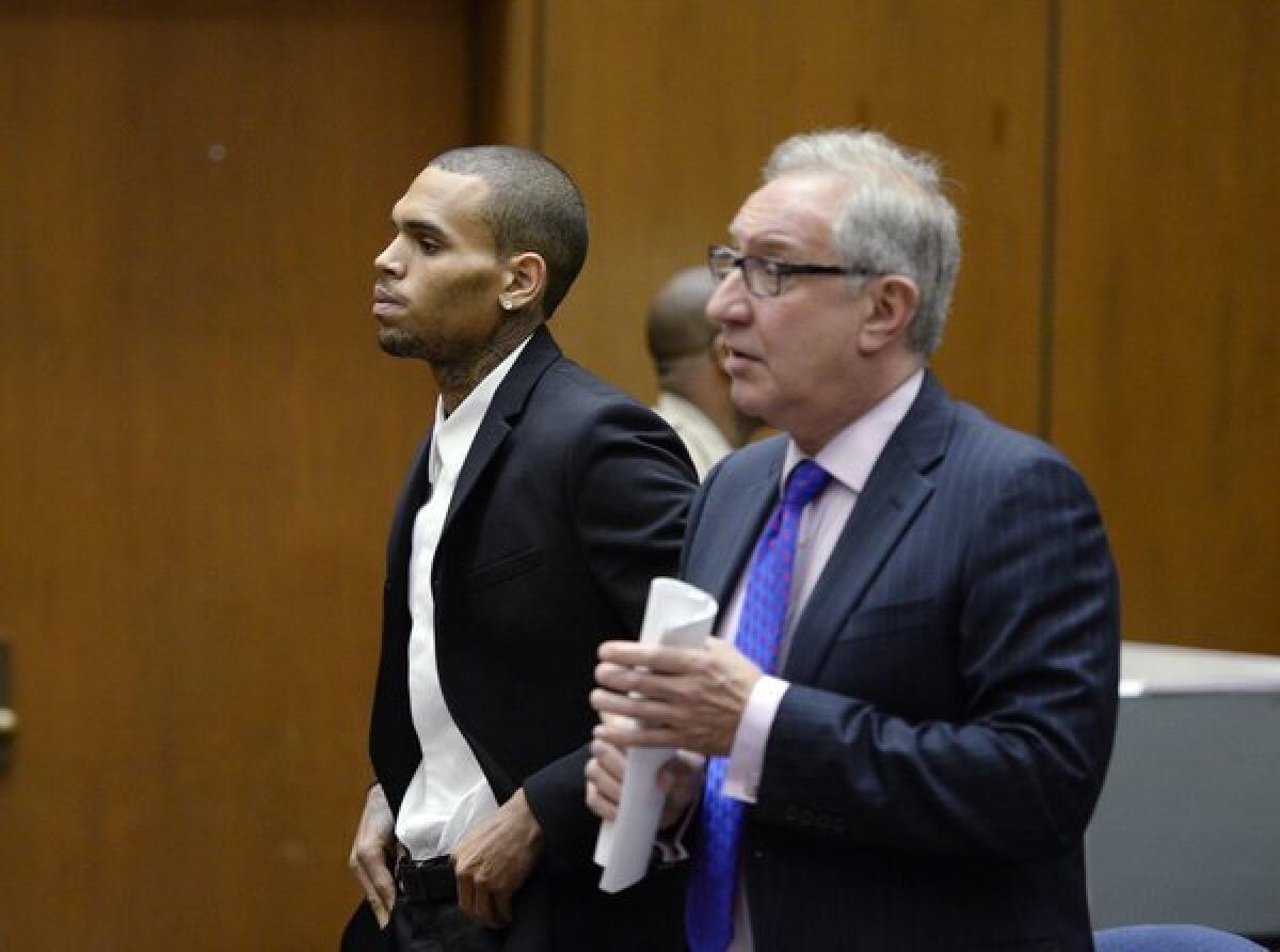 R&B singer Chris Brown appears in court with his attorney for a probation violation hearing on Aug. 16 in Los Angeles.