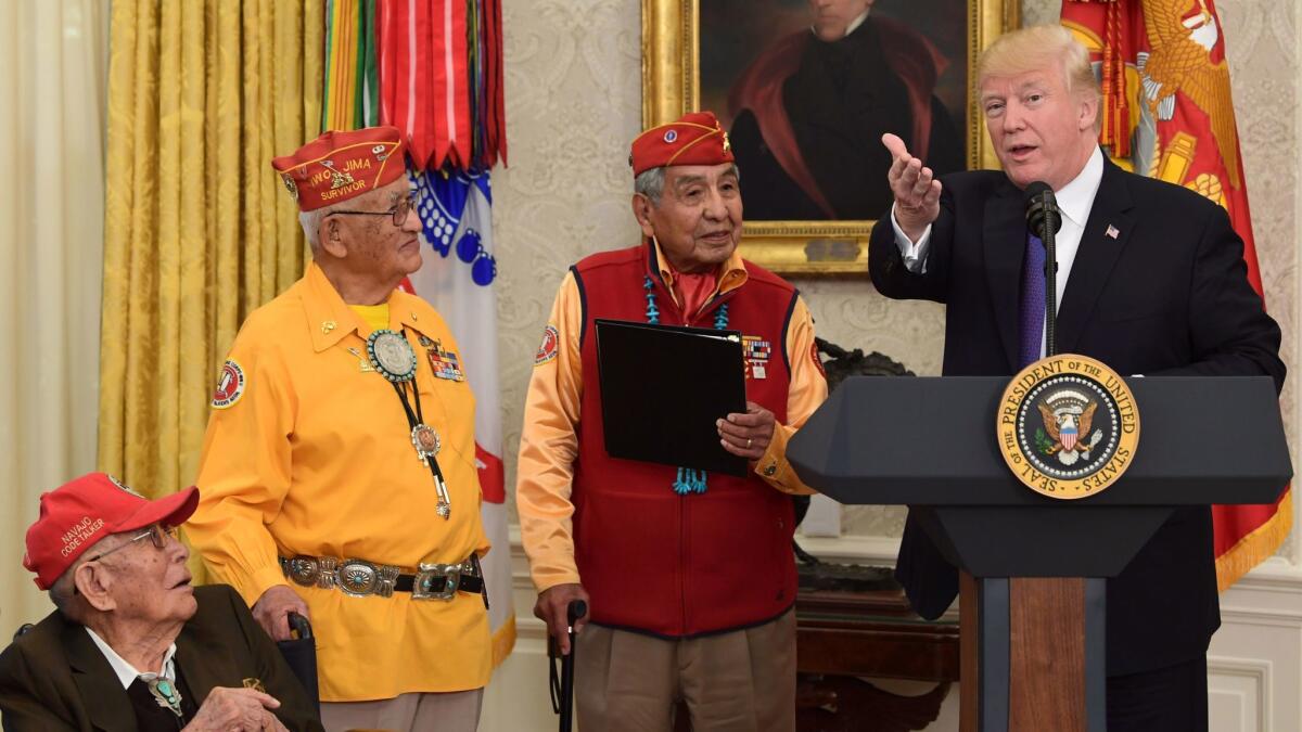 President Trump speaks during a meeting on Nov. 27 with Navajo code talkers, including, from left, Fleming Begaye, Thomas Begay and Peter MacDonald.